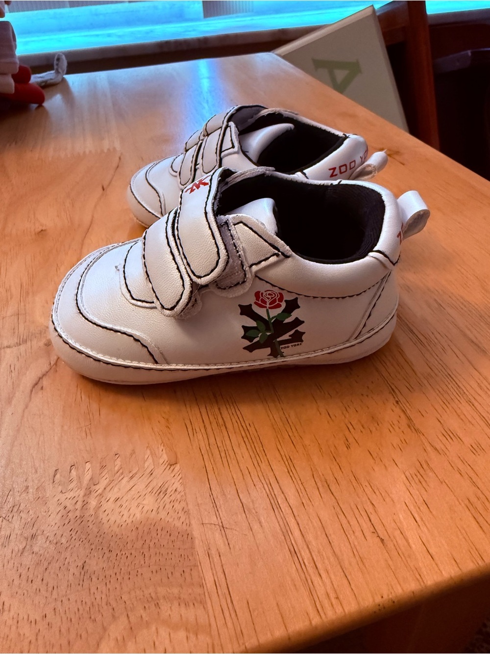 Baby White Sneakers with Rose Accent - zoo York size 2